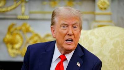 Trump signs order slashing Japanese auto tariffs to 15%